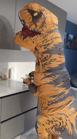 Inflatable T-Rex costume in a Saint Petersburg kitchen