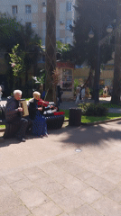 Street musicians perform on sunny Sochi promenade