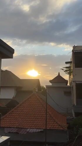 Sunset hour on Bali's coast: beaches, ships, and golden skies