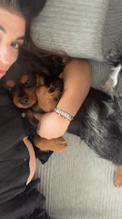 Woman and dog share quiet evening rest in Puebla