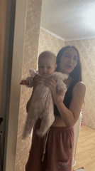 Woman's quiet Sunday evening at home in Sochi with baby