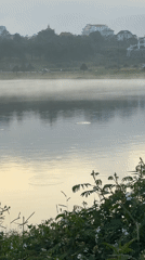 Early morning activity along Da Lat's misty lakeside path