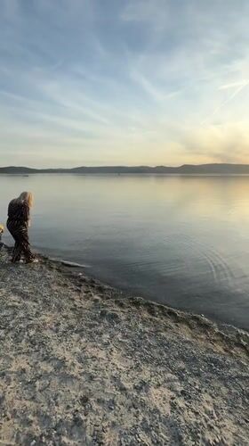 Sunset gathering at Turgoyak beach draws visitors on spring evening