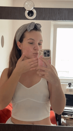 Woman records mirror selfie in Belgrade suburb