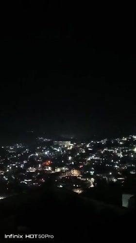 Caracas nights from above, plus a dog playing fetch indoors