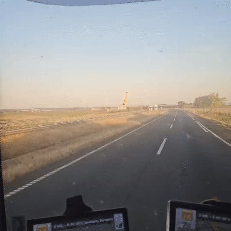 Large yellow person sculpture spotted along Spanish highway