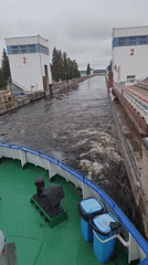 Cargo ships navigate Volga-Don Canal locks near Белоусово