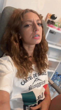 Woman photographed wearing cartel-themed shirt in Thailand office