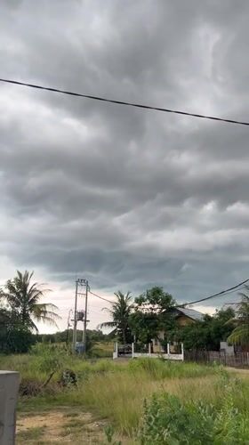 Domestic life documented amid overcast skies in Lhokseumawe, Indonesia