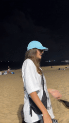 Evening beach gathering and night market activity in Nha Trang