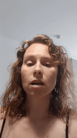 Woman records personal videos in Yekaterinburg kitchen