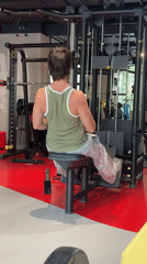 Seated cable row exercise at a Moscow gym.