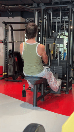 Seated cable row exercise at a Moscow gym.