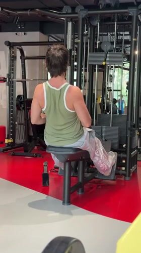 Seated cable row exercise at a Moscow gym.