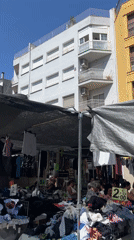 Street market and graffiti murals fill Mollet del Vallès on a summer morning