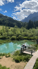 Wooden boardwalk and viewing platform at turquoise lake Slovenia