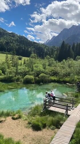 Wooden boardwalk and viewing platform at turquoise lake Slovenia