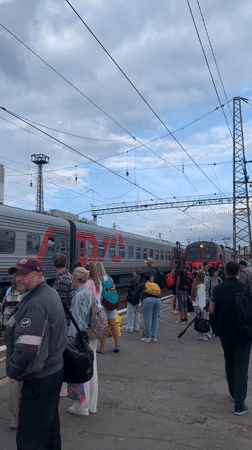 Morning rush at Perm-1 station, trains loading and platforms busy