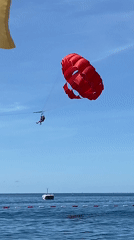 Morning beach recreation and parasailing documented in Budva Montenegro