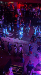 Late-night Fort Lauderdale club crowd fills the floor under DJ set