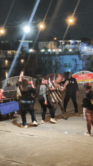 Live outdoor music and dancing under string lights in Surakarta