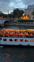 Evening river cruise and street life documented along Paris Seine