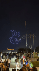 Drone light show spells patriotic phrases over LA crowd at night