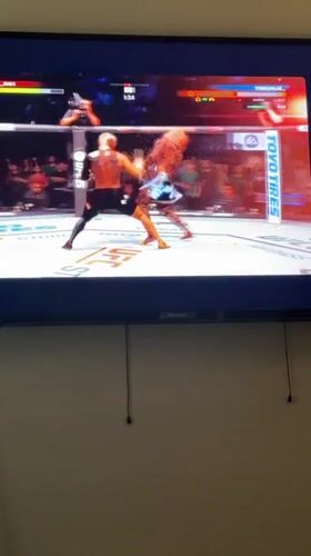 Video game footage captured showing UFC fighting gameplay in Arlington