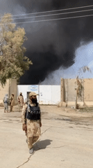 Soldiers observed near compound as black smoke rises in Afghanistan