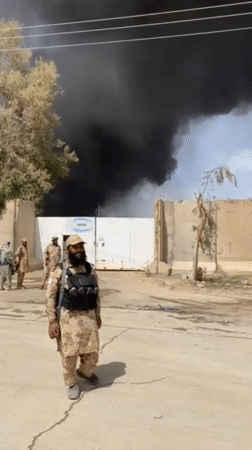 Soldiers observed near compound as black smoke rises in Afghanistan