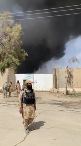 Soldiers observed near compound as black smoke rises in Afghanistan