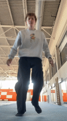 Person performs standing backflip in Krasnoyarsk gymnasium