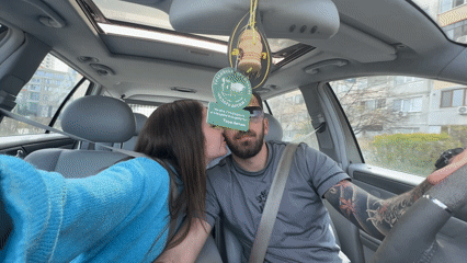 Couple singing and showing affection in car in Burgas