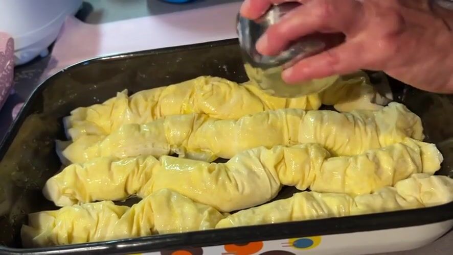 Traditional phyllo pastry preparation documented in Bulgarian village kitchen