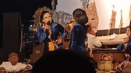Gamelan concert with vocalists in blue, Tanahbaya, Indonesia
