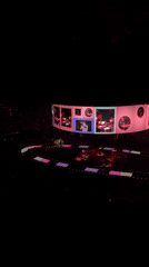 Live arena concert, New York, circular stage with LED overhead screen