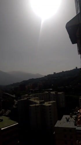 Caracas cityscape captured through hazy midday sun