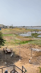Reservoir life in Desa Sobokerto: fish farms, food stalls, lakeside cafes