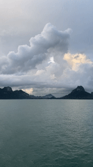 Calm waters and silhouetted islands captured in Don Sak