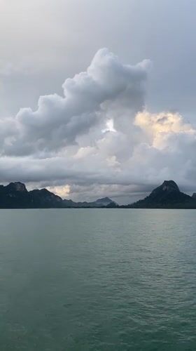 Calm waters and silhouetted islands captured in Don Sak