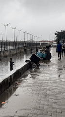 Rainy morning deliveries and construction traffic in Igboefon, Lagos