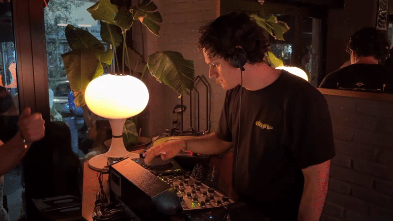 DJ performs while soju consumed in Milan evening