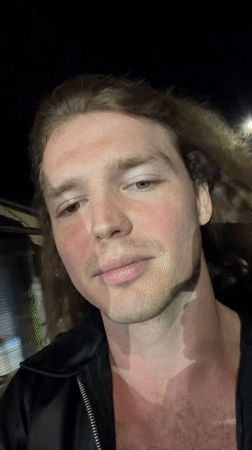Man Records Nighttime Selfie Videos on North Kuta Street