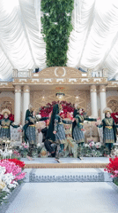 Traditional performance in green and gold at Mesjid Beurabo
