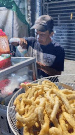 Night food vendors serve traditional snacks in Central Jakarta