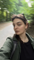 Woman films selfie on forest path in Slovakia