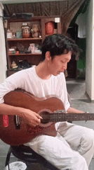Acoustic guitar session in a casual Kebumen indoor setting