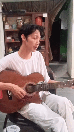 Acoustic guitar session in a casual Kebumen indoor setting