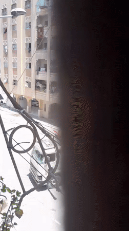 Debris clearance and street activity in Khan Yunis