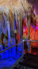 Tourist documents illuminated cave formations in Bulgarian underground systems